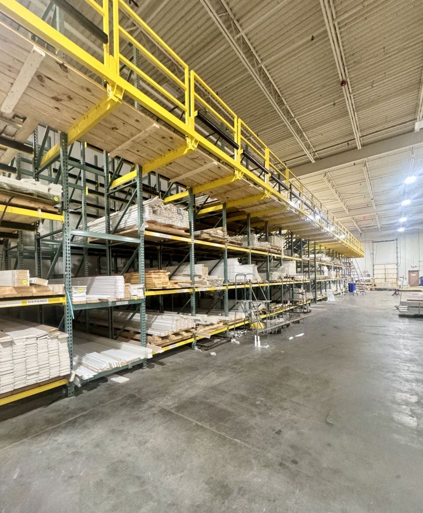Racked door and trim inventory inside the Heavin warehouse